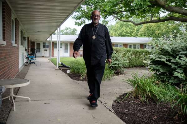 Photo of A man strolling through a MetroRock property.