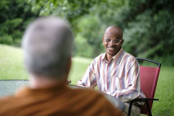 Photo of A MetroRock housing resident smiling during an interview.