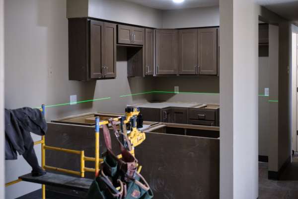 Photo of A laser leveling tool in a renovated room.