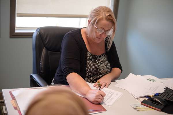 Photo of A MetroRock employee filling out forms.